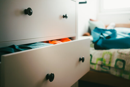 A half-open drawer with things