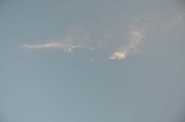 White translucent clouds. Against the blue sky. On a clear spring day, translucent high cirrus...