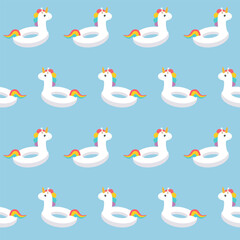 Seamless pattern with unicorn swim ring on blue background.