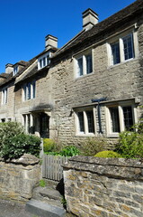Exterior view of beautiful old terraced cottage houses on a street in an English town
