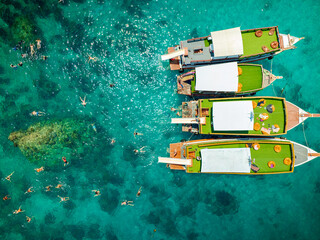 Top aerial view of  natural bay serving ton of traveler tourist  take bundle of tour boats dropped...