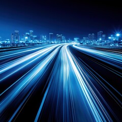 Fototapeta premium Cityscape at night with light trails from traffic on highway long exposure blue tone urban scene