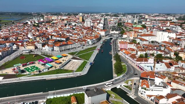 Aerial view of Aveiro, Portugal showing boats in central canal lined by historic buildings and roads