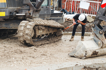 Excavator lost broken track and awaiting for repair © Iryna