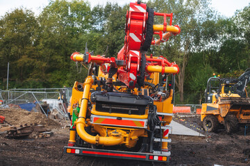 Mobile concrete pump set on construction site ready for pouring concrete slab