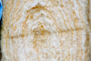 Close-up of textured soft and fluffy rockwool insulation roll