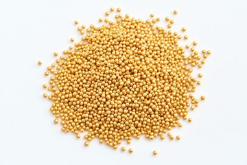 Golden, round sprinkles, clustered in a pile on a white background.  Small, uniformly sized spheres, glittering with a gold hue