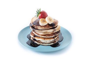 Pancakes with chocolate and fruit isolated on white background