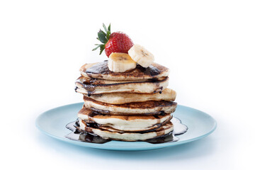 Pancakes with chocolate and fruit isolated on white background