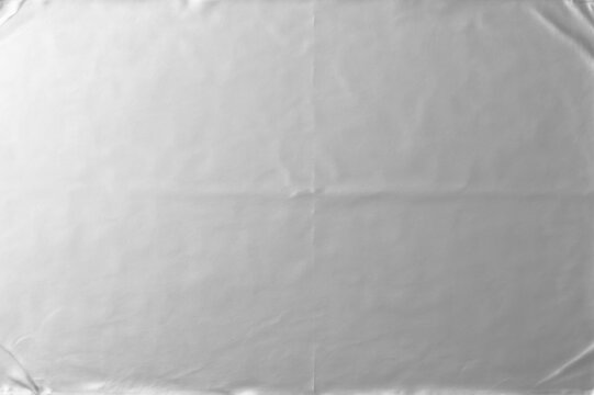 Wrinkled silver foil texture. Silver paper design overlay, abstract backgrounds.