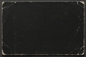 Vintage aged scratched black paper texture with torn corners. Abstract background, design overlay.