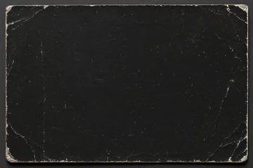 Vintage aged scratched black paper texture with torn corners. Abstract background, design overlay. © elovich