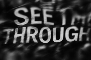 Abstract black letters on white background with distressed, grunge texture.
