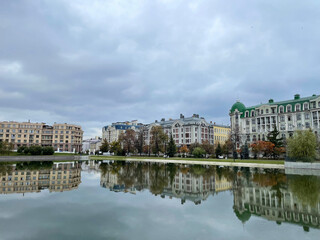Houses in the center of Kazan reflected in the water of the Black Lake, Russia