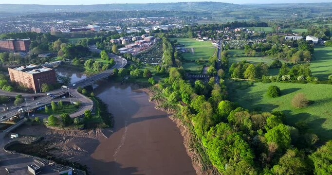 Aerial video over River Avon in Bristol UK showing traffic flowing on Brunel Way 