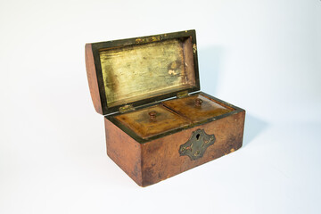 Open antique wooden tea caddy on white background, showcasing compartments for tea storage. Vintage craftsmanship and historical charm, perfect for collectible and heritage themes.