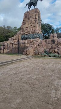 Vertical ascending video of the view of the main tourist monument of Guemes in the city of Salta, Argentina