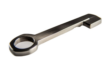 a silver key with a hole in the middle