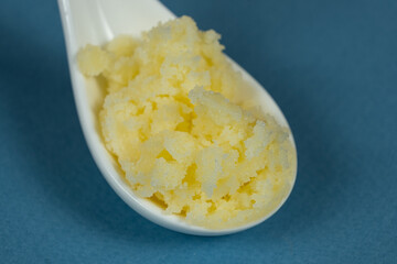 Traditional Indian Ghee In Spoon, Golden Texture.