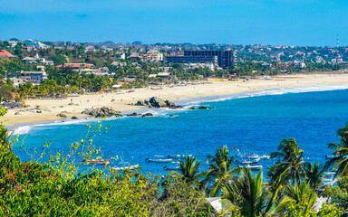 Fototapeta premium Sun beach sand surfer waves palms in Puerto Escondido Mexico.