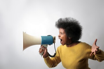 woman shouts with a megaphone