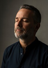 Obraz premium Man with closed eyes in pensive mood