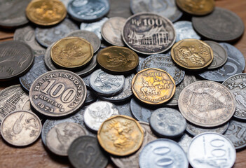 Various old Indonesian rupiah coins that are no longer used as a means of exchange and buying and selling.