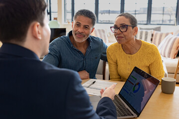 Joyful Couple Engaging with Financial Consultant