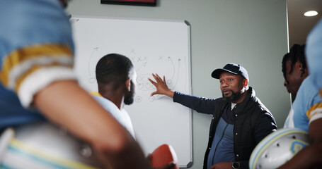 Board, teamwork and football with coach and men in locker room for game plan, sports strategy or defense formation. Touchdown tactics, match feedback and discussion with people and training advice