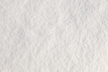 Obraz premium Natural snow texture. ice snow crust surface. Snowy ground. Winter background of Christmas and New Year design. Top view