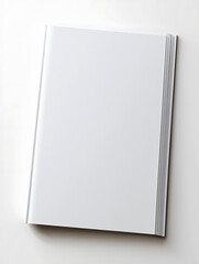 A pristine blank-covered book rests diagonally its thick pages suggesting a volume yet to be filled with stories or knowledge.