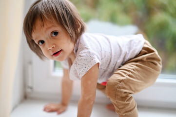 Baby girl near the window