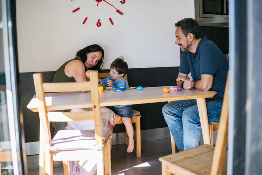 Family enjoying creative playtime with modeling clay