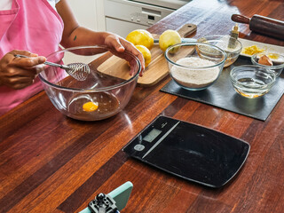 Baking ingredients and tools arranged on wooden table