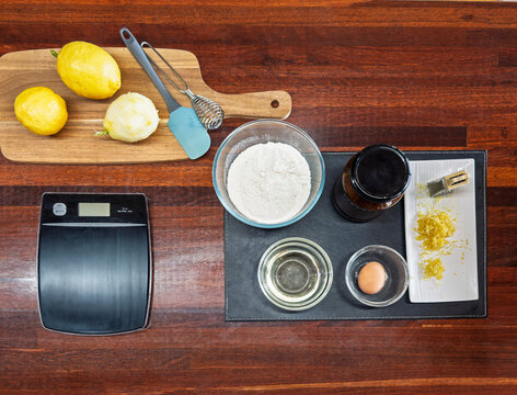 Baking essentials with lemons and ingredients on a table
