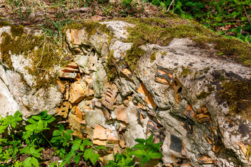 Old concrete block filled with broken bricks