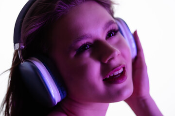 Young Woman Enjoying Music Through Large Comfortable Headphones
