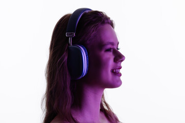 Young Woman Enjoying Music Through Large Comfortable Headphones