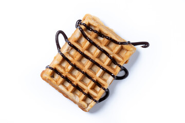 Belgian Waffles with chocolate syrup isolated on white background. Top view
