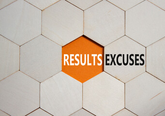 Results or Excuses symbol. Concept word Results or Excuses on wooden comb puzzle. Beautiful orange...