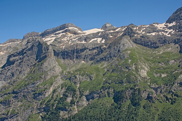Granite alpine mountain top with glacier on a sunny day with clear blue sky in La Vanoise national park, france 