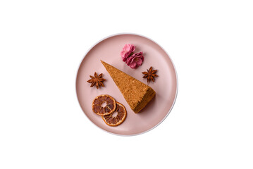 A slice of honey puff cake or pumpkin, carrot and cream pie, vegan sweets