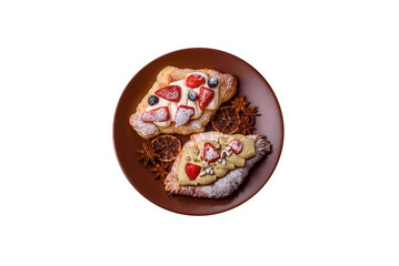 Food for breakfast sweet strawberry croissants with chocolate filling