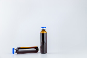 Oral liquid medical drugs on a grey background