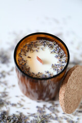lavender candle in a glass from a recycled brown bottle