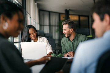 A diverse, talented team collaborates effectively in a bright office space during a business meeting