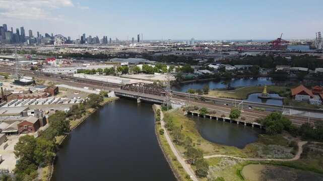 Aerial drone above Maribyrnong River, Melbourne, under a cloudy sky