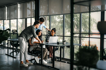 A diverse, talented team collaborates effectively in a bright office space during a business meeting