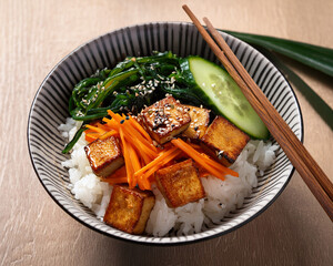 Seaweed, Carrots, Cucumbers, and Pan-Fried Tofu in an Asian Rice Bowl