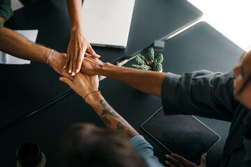 Fototapeta na wymiar Diverse group of business people's hands showing unity and teamwork. Diverse hands for teamwork
